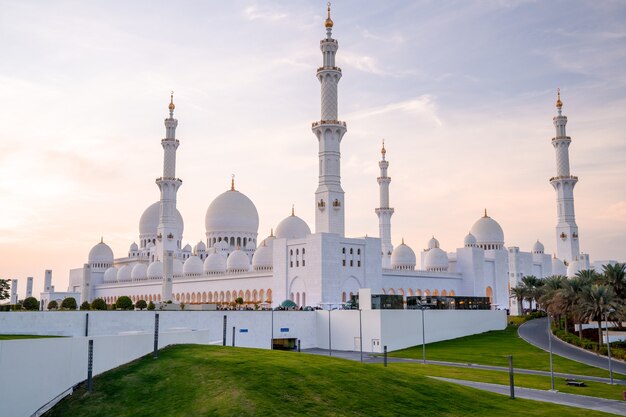 Grand Mosque in Abu Dhabi in the evening during sunset. Panorama of exterior of Sheikh Zayed Mosquein UAE.