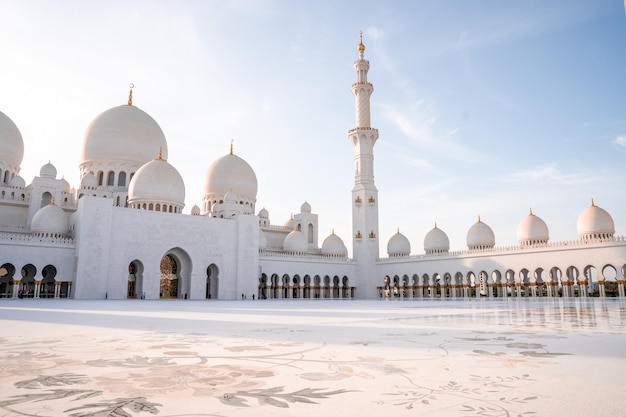 Grand Mosque in Abu Dhabi in the evening during sunset. Panorama of exterior of Sheikh Zayed Mosquein UAE.