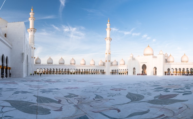 Grand Mosque in Abu Dhabi in the evening during sunset. Panorama of exterior of Sheikh Zayed Mosquein UAE.