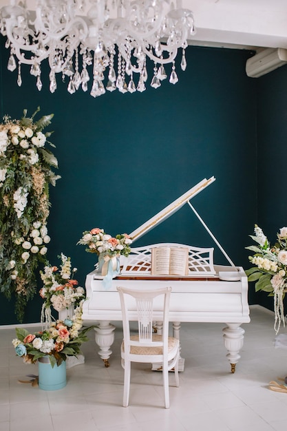 Grand piano flowers in studio piano surrounded by flowers