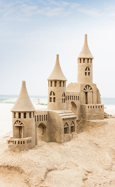 Grand sandcastle on the beach during a summer day