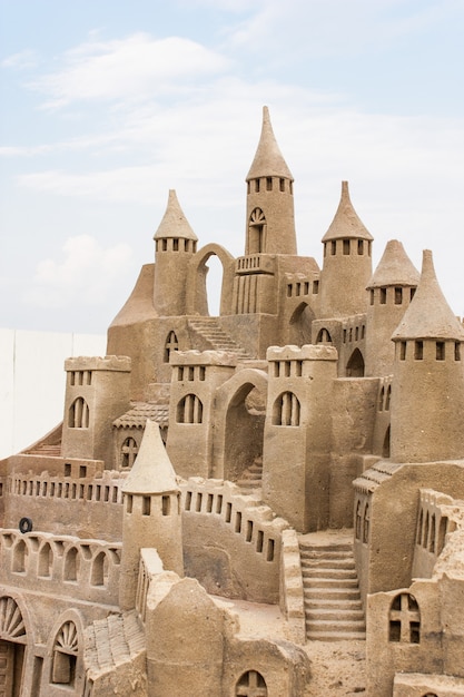 Grand sandcastle on the beach during a summer day