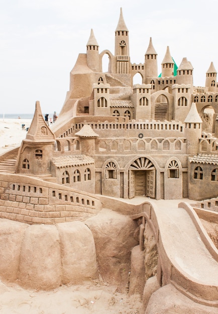 Grand sandcastle on the beach during a summer day