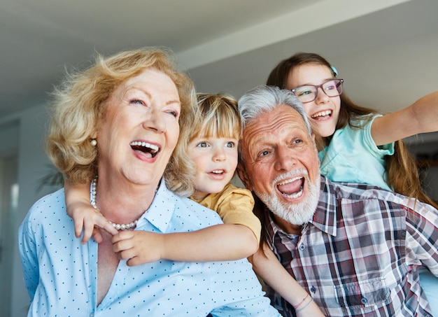 Photo grandchild family child grandparent man woman grandfather happy together grandmother girl senior