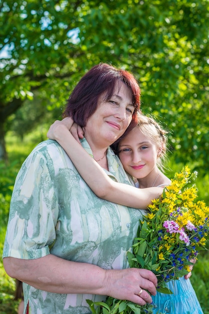 Granddaughter hugs her grandmother