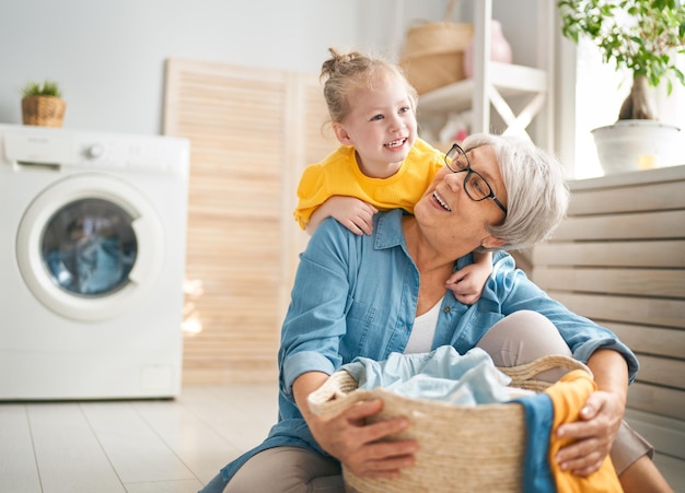 Grandma and child are doing laundry