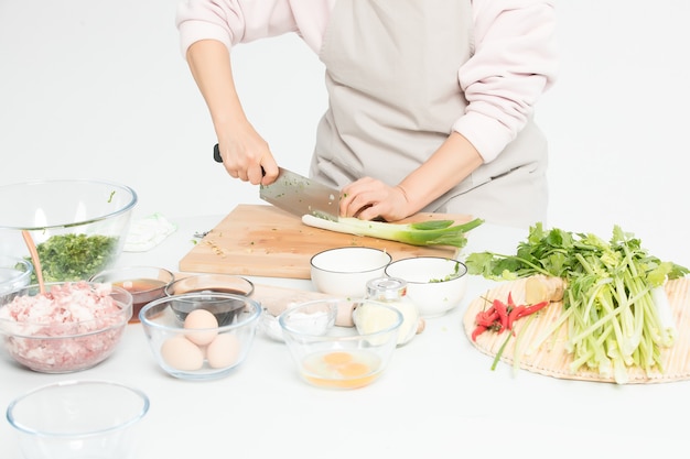 Grandma is processing fresh vegetables