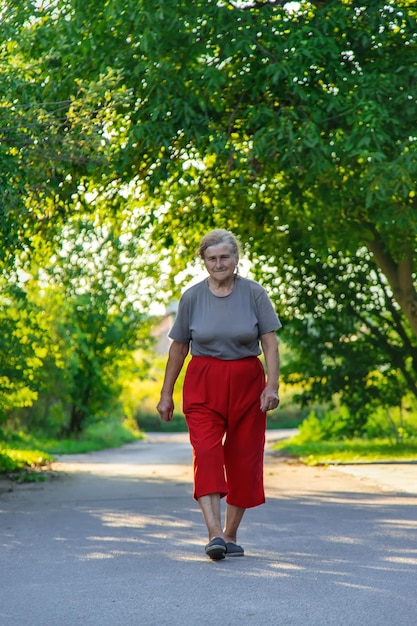 Grandma is walking down the road Selective focus