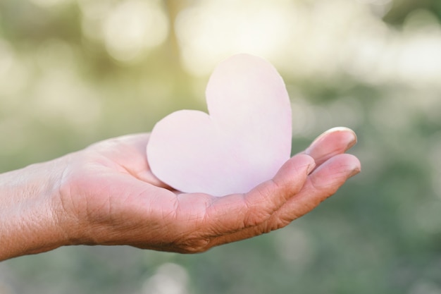 Grandma's hand holds a heart