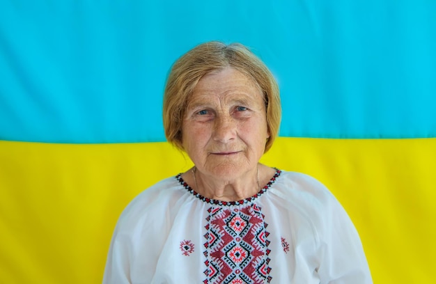 Grandmother is a Ukrainian patriot in an embroidered shirt selective focus
