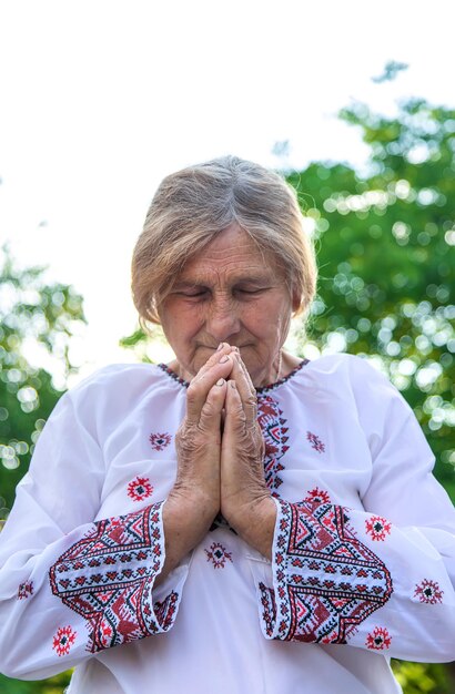 Grandmother in Ukrainian embroidered clothes Selective focus