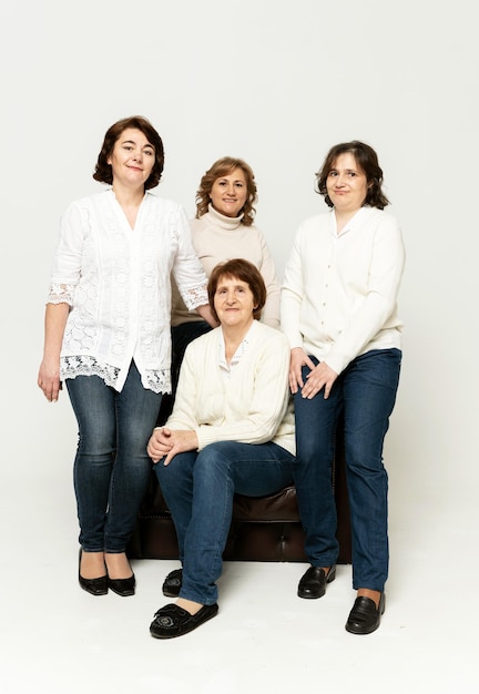 Grandmother with daughters on a white background