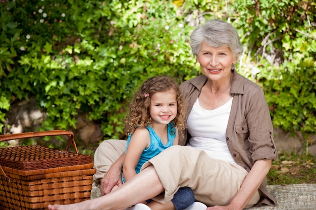 Grandmother with her granddaughter in the garden