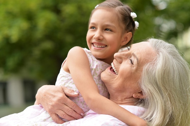 Grandmother with her granddaughter  in the park