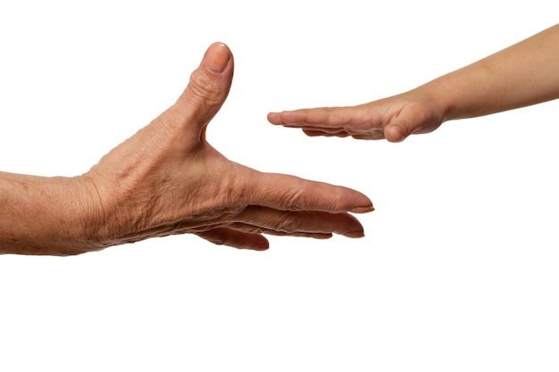 Grandmothers hands with little girl hands isolated on white background