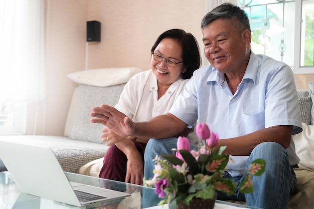 Photo grandpa and grandma were a video call on laptop to say hello