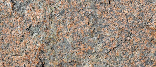 Granieten oppervlak. Textuur van granieten steen. Gebarsten natuursteen oppervlak. Ruimte kopiëren