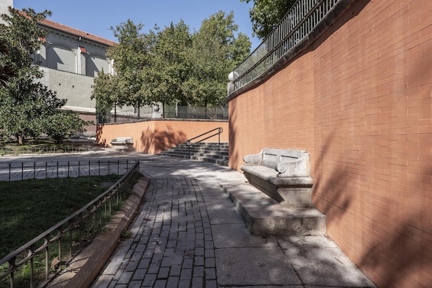 Granite benches on a brick wall