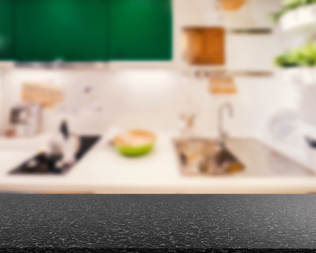 Granite countertop with kitchen blurred background