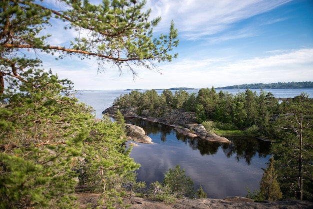 Granite island of Sortavaly in summer under a blue sky Top view of the lake and the stone islands