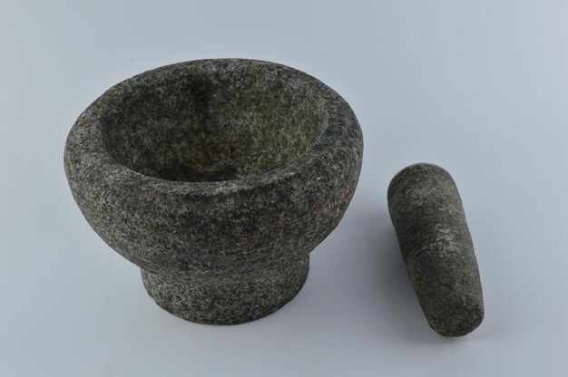 Granite pestle and mortar isolated on a white background