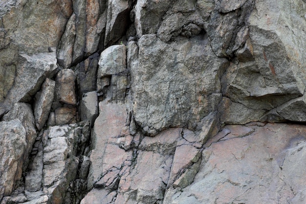 Granite rocks with faults Destruction of granite wall