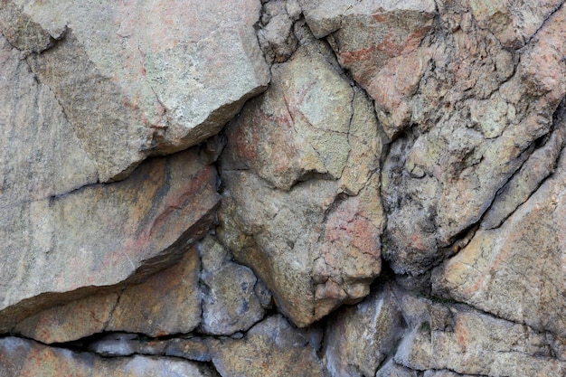 Granite rocks with faults Destruction of granite wall