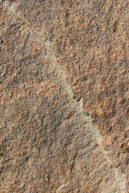 花崗岩の石のテクスチャ大まかな構造の花崗岩の背景を持つ天然石の花崗岩の壁