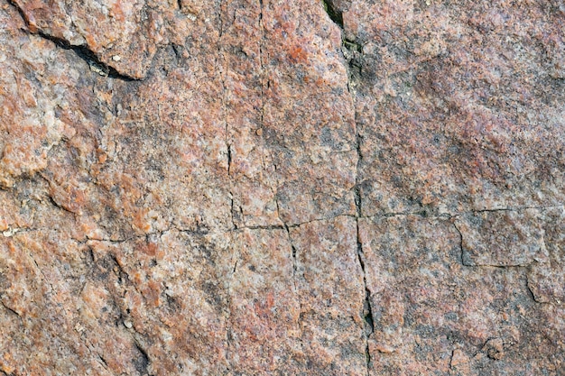 Granite surface. Texture of granite stone. Cracked natural stone surface. Copy space