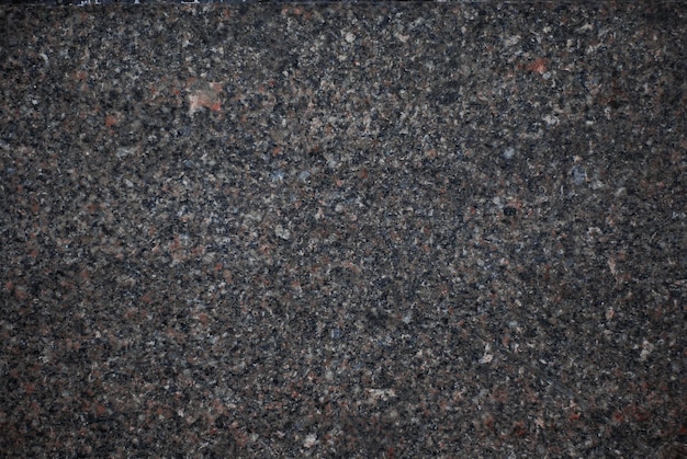 Granite texture The stone granite surface A variegated spotted background of granite