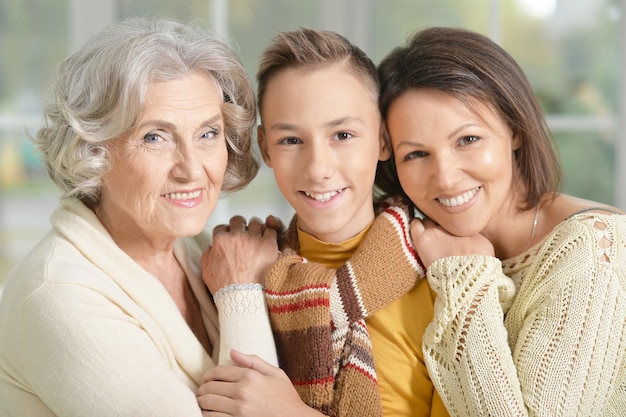 Photo granny, mother and son close up portrait