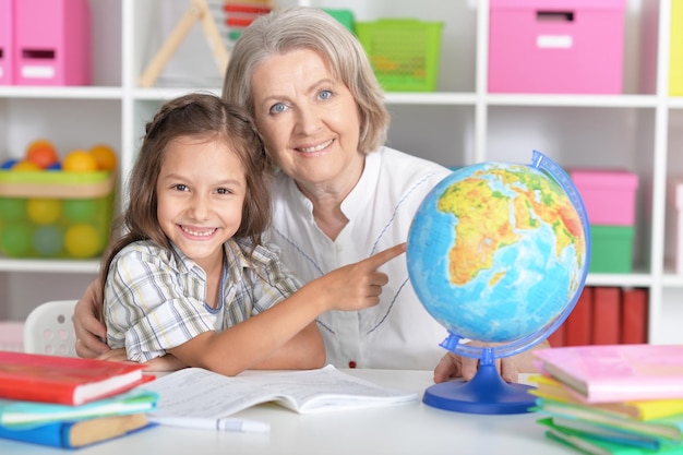 Granny with granddaughter doing homework