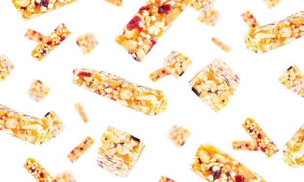 Granola bar isolated on white background. Muesli bar isolated. Granola bars flying. Falling bars. High quality photo