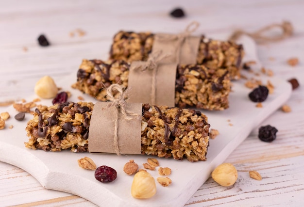 Granola bars on a wooden boardCloseup