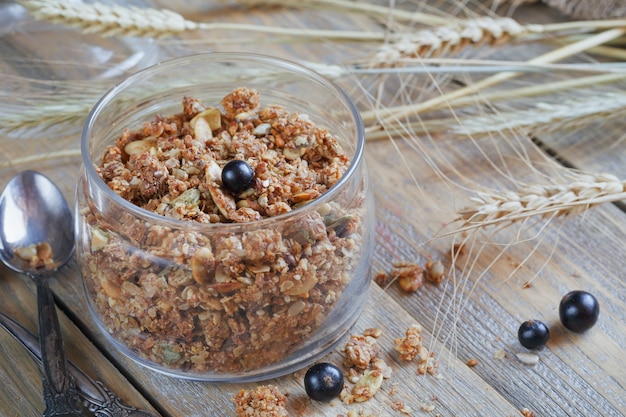 Granola, berries and ears of wheat and oats.