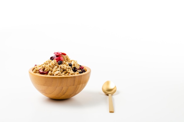 Photo granola in bowl on white background