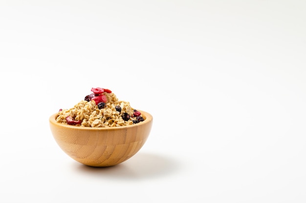 Granola in bowl on white background