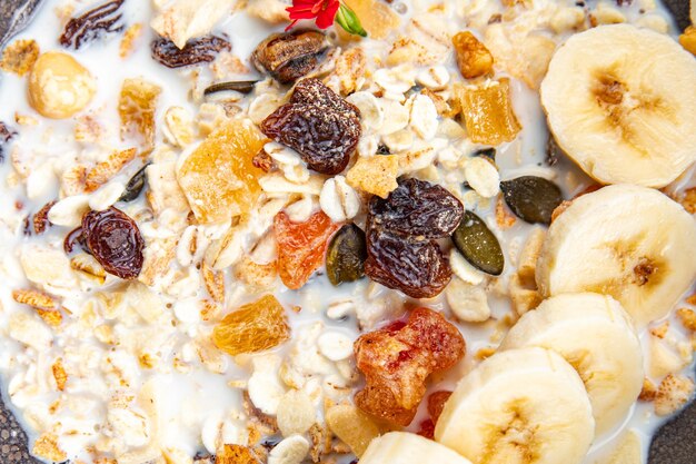 granola bowl with milk dried fruit and fresh banana tasty breakfast ready to eat healthy meal food