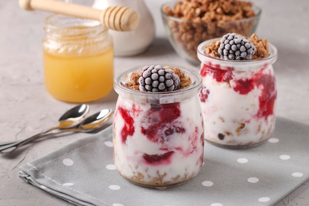 Granola crispy honey muesli with frozen blackberries cottage cheese and natural yogurt