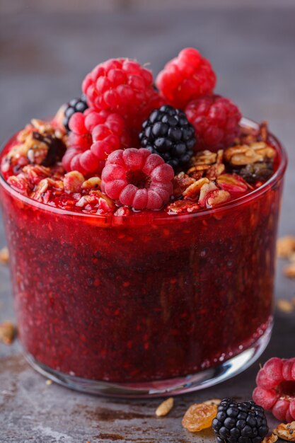 Granola, fresh berries,berry puree.Summer healthy breakfast.