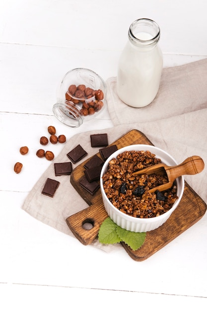 granola and milk on a light background