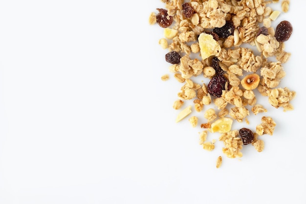 Granola muesli with nuts and dried fruits on a white background copy space supermarket products