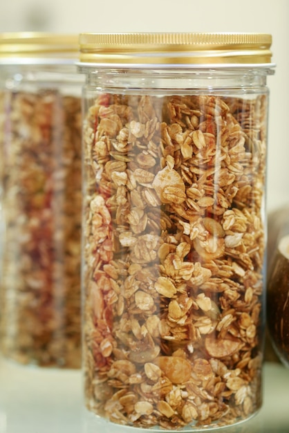 Granola Musli in a transparent jar on table