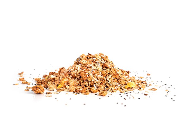 Granola van hele havervlokken met kokoschips, ananas en chiazaden geïsoleerd op een witte achtergrond. Muesli geïsoleerd. Een snel ontbijt. Gezond ontbijt. Hoge kwaliteit foto