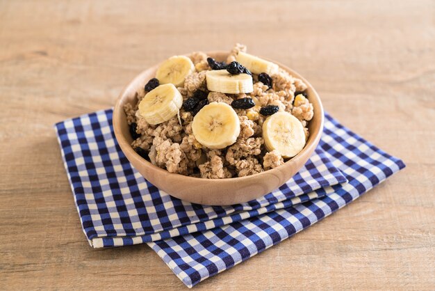 granola with banana, raisin and milk 