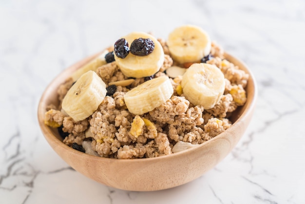 granola with banana, raisin and milk 