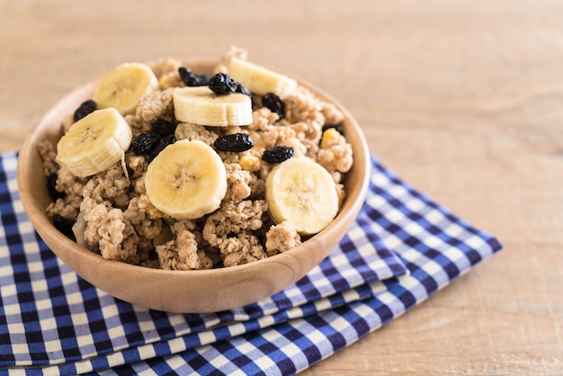 granola with banana, raisin and milk 