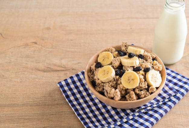 granola with banana, raisin and milk 