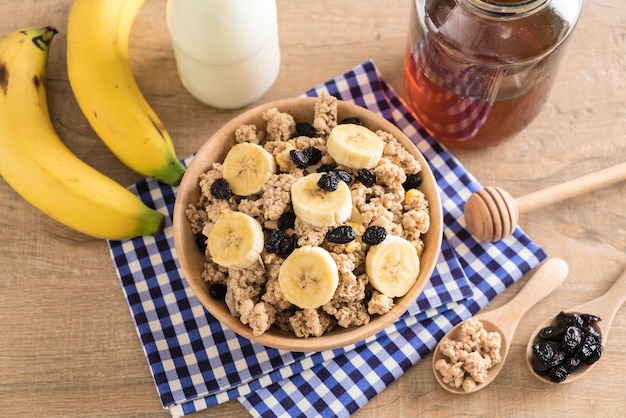 granola with banana, raisin and milk 