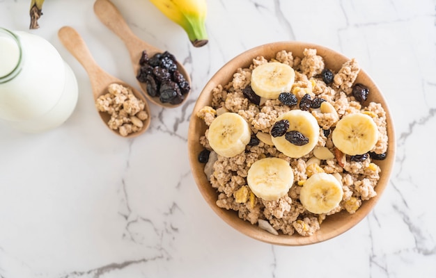 granola with banana, raisin and milk 